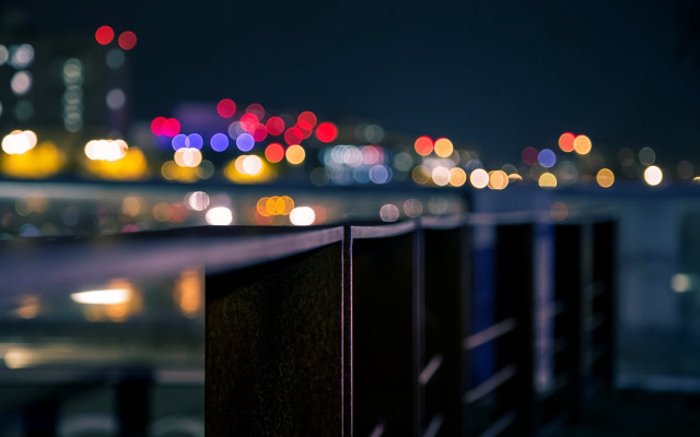 City skyline night fence bokeh free wallpaper for desktop - medium preview image