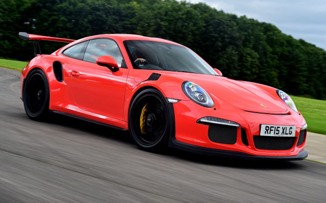 Red porsche sports car driving free wallpaper for desktop - medium preview image