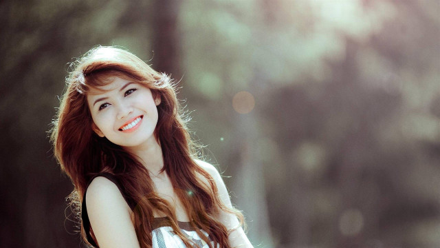 Woman long hair smiling forest free wallpaper for desktop - medium preview image