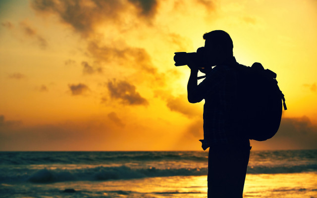 Beach sunset man camera ocean free wallpaper for desktop - medium preview image