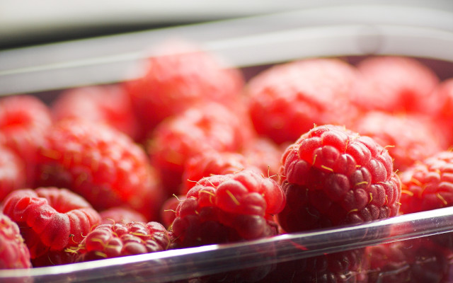 Raspberries plastic container table white free wallpaper for desktop - medium preview image
