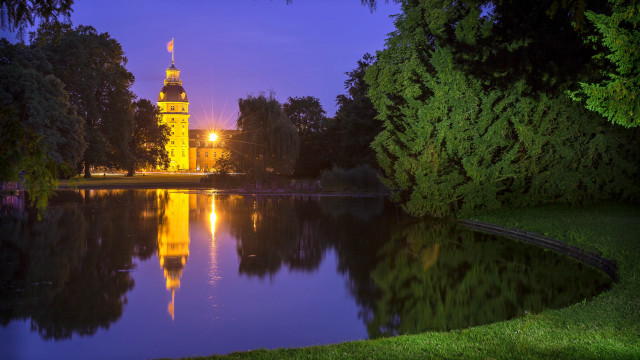Large building tower lake night free wallpaper for desktop - medium preview image