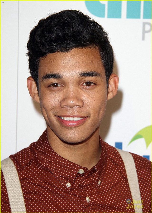 Young man smiling suspenders camera free wallpaper for mobile - medium preview image