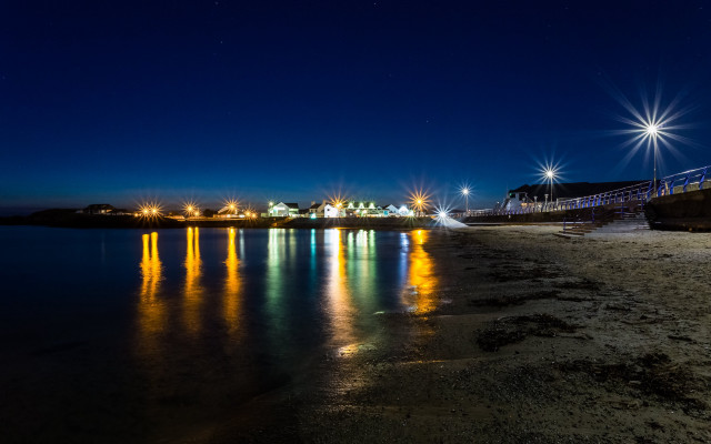 Night beach pier lights reflection free wallpaper for desktop - medium preview image