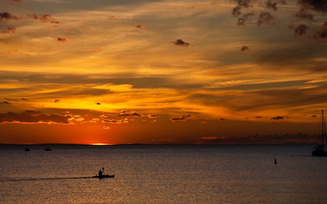 Sunset boat water clouds pastel free wallpaper for desktop - medium preview image
