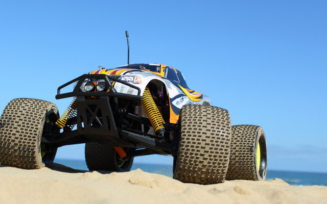 Large truck sand ocean day free wallpaper for desktop - medium preview image