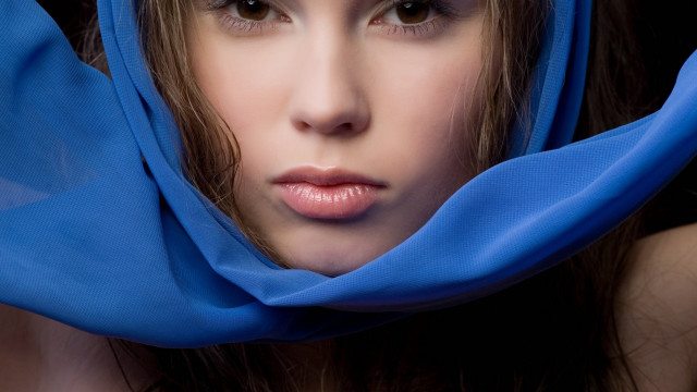 Woman blue scarf serious portrait free wallpaper for desktop - medium preview image