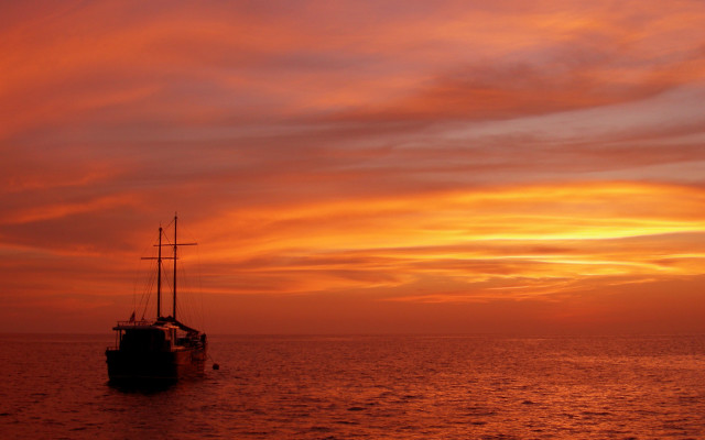 Boat sunset orange red clouds free wallpaper for desktop - medium preview image