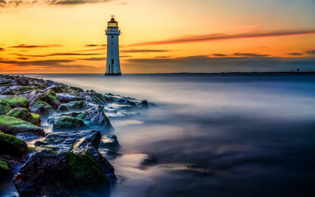 Lighthouse rocky shore sunset water #3 free wallpaper for desktop - medium preview image