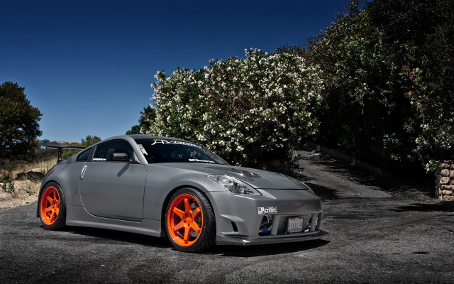Gray car orange rims parking free wallpaper for desktop - medium preview image