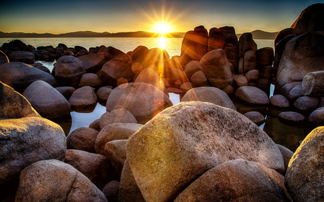 Sunset water rocks lens flare free wallpaper for desktop - medium preview image