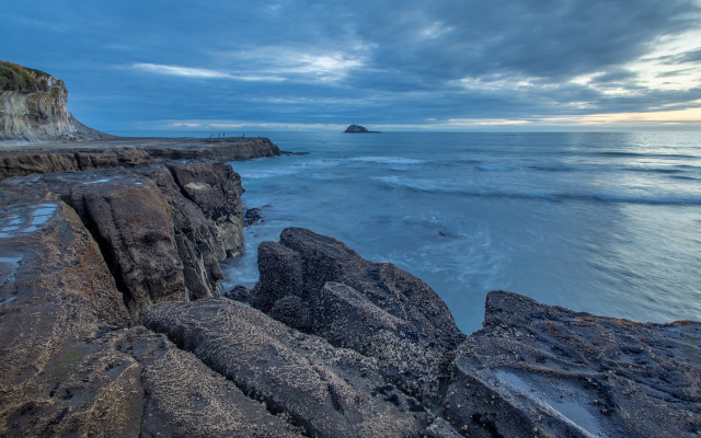 Rocky cliff water outcropping beach #2 free wallpaper for desktop - medium preview image