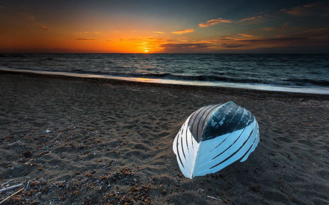 Sandy beach boat sunset ocean free wallpaper for desktop - medium preview image