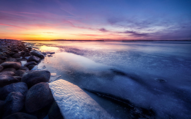 Sunset water rocks ice shore free wallpaper for desktop - medium preview image