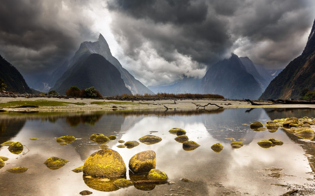 Mountain range ocean rocks cloudy free wallpaper for desktop - medium preview image