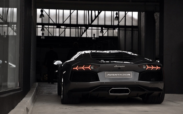 Black sports car garage man #2 free wallpaper for desktop - medium preview image