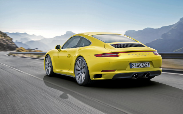 Yellow porsche mountain road sky free wallpaper for desktop - medium preview image