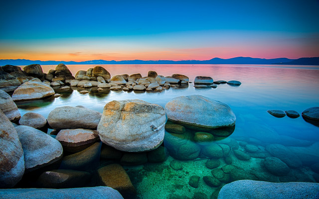 Rocky shore sunset mountains ocean free wallpaper for desktop - medium preview image