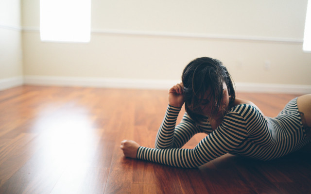 Woman sitting floor head hands free wallpaper for desktop - medium preview image