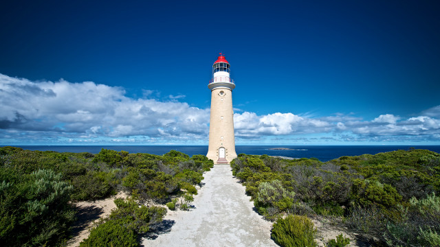 Lighthouse hill blue sky path free wallpaper for desktop - medium preview image