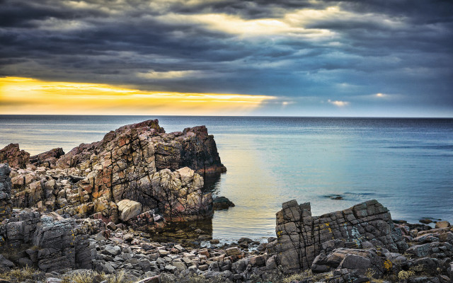 Rocky shore lake sunset bridge free wallpaper for desktop - medium preview image