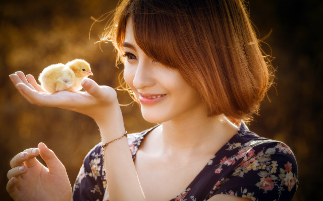Woman smiling holding chicken floral free wallpaper for desktop - medium preview image