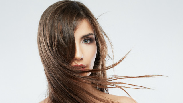 Woman blowing hair blue eyes #4 free wallpaper for desktop - medium preview image