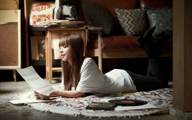 Woman lying reading book brown free wallpaper for desktop - medium preview image