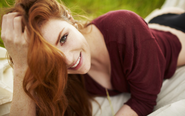 Woman smiling blurry redhair portrait free wallpaper for desktop - medium preview image