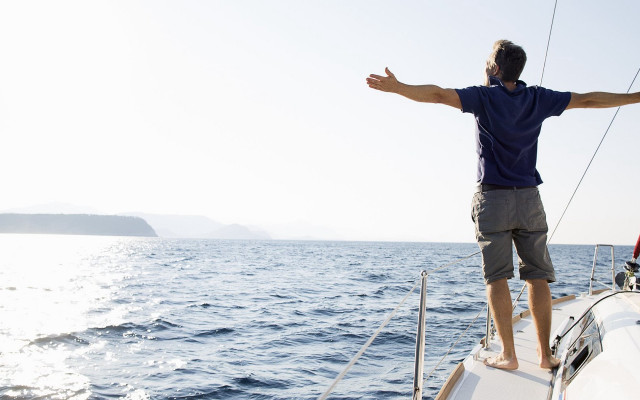 Man boat ocean outstretched arms free wallpaper for desktop - medium preview image