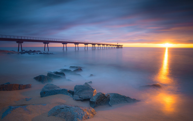 Sunset pier ocean rocks city free wallpaper for desktop - medium preview image