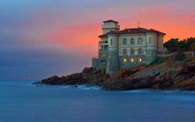 Cliffside mystical building sunset ocean free wallpaper for desktop - medium preview image