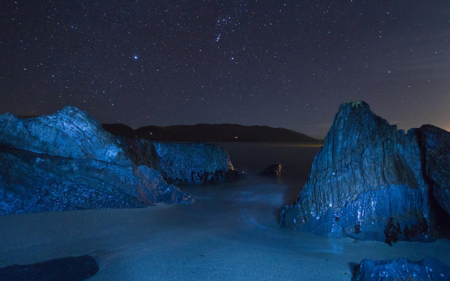 Night sky stars water rocks free wallpaper for desktop - medium preview image