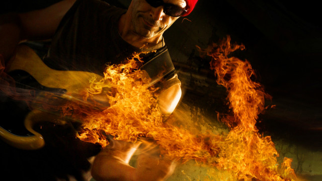 Fire guitar man embers autumn free wallpaper for desktop - medium preview image