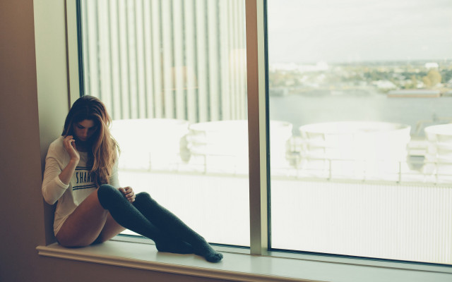 Woman window sill city tilt free wallpaper for desktop - medium preview image
