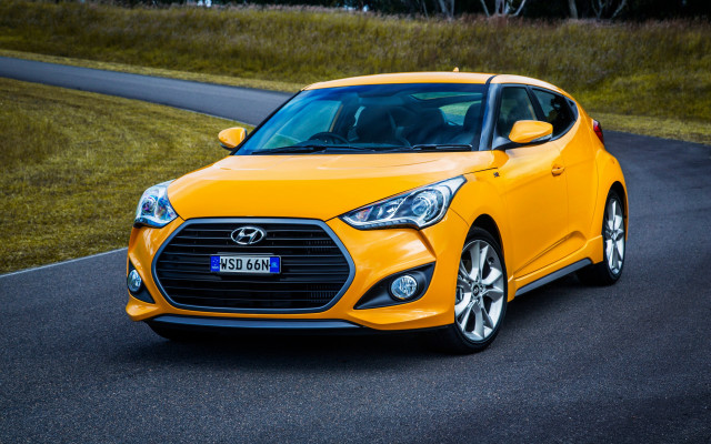 Yellow car driving green field free wallpaper for desktop - medium preview image