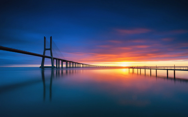 Sunset bridge water sky mountains free wallpaper for desktop - medium preview image
