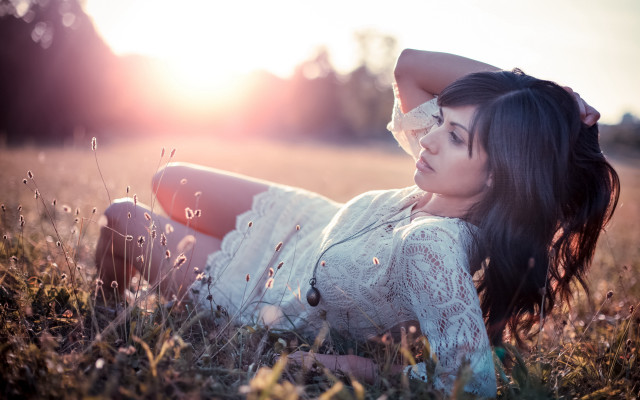 Woman grass field blowing hair free wallpaper for desktop - medium preview image