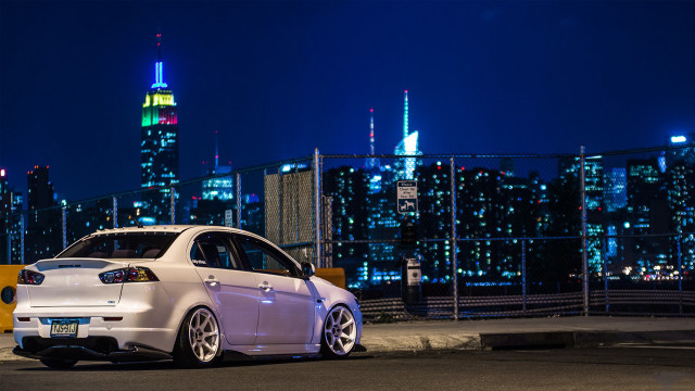 White car night city skyline free wallpaper for desktop - medium preview image