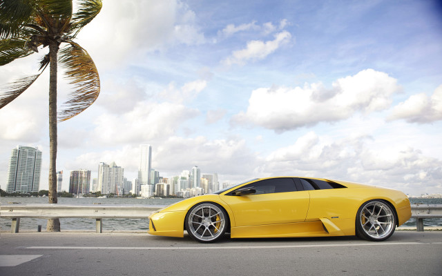 Yellow sports car city skyline free wallpaper for desktop - medium preview image