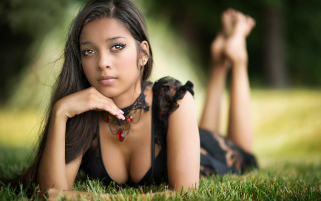 Woman lying grass hands chest free wallpaper for desktop - medium preview image