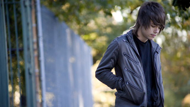 Man standing fence hands on free wallpaper for desktop - medium preview image