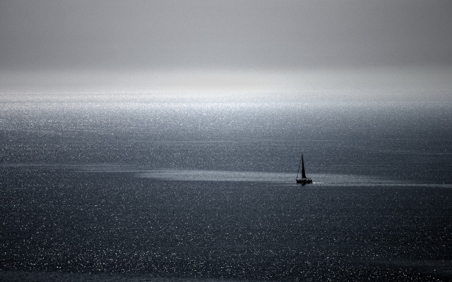 Sailboat foggy ocean minimalist tranquil free wallpaper for desktop - medium preview image