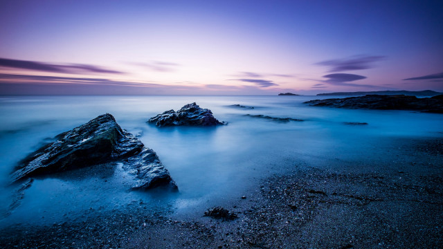 Purple sky beach rocks long free wallpaper for desktop - medium preview image