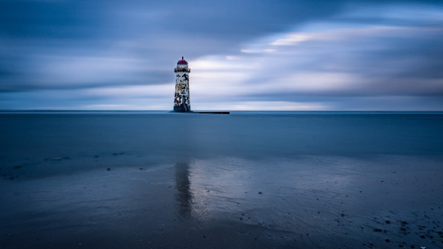 Lighthouse beach cloudy sky reflection free wallpaper for desktop - medium preview image