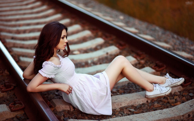 Woman sitting train track photorealistic free wallpaper for desktop - medium preview image