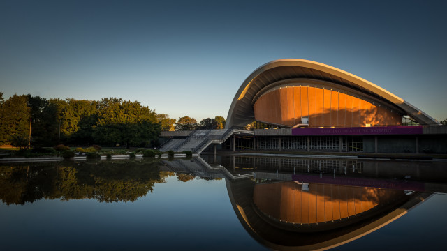 Curved roof building water trees free wallpaper for desktop - medium preview image