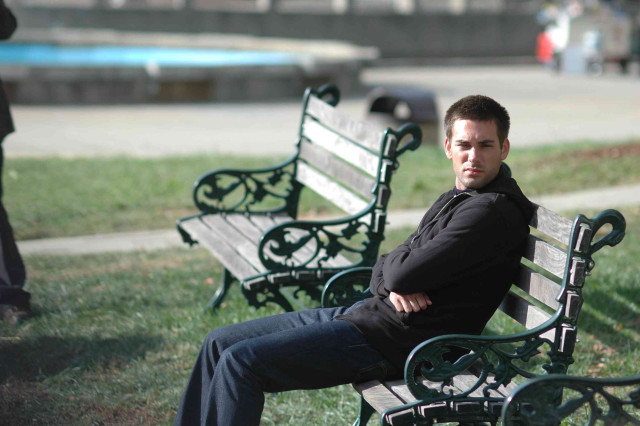 Man sitting bench park arms free wallpaper for desktop - medium preview image