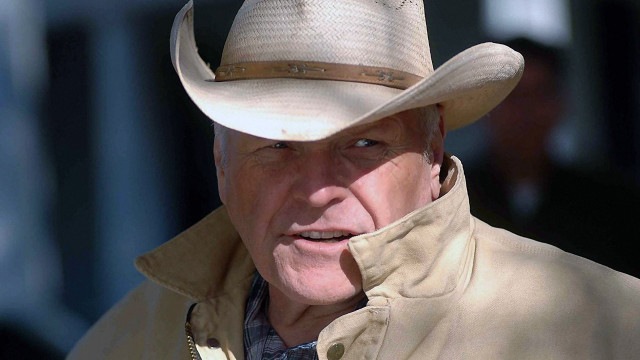 Cowboy man serious blue eyes free wallpaper for desktop - medium preview image