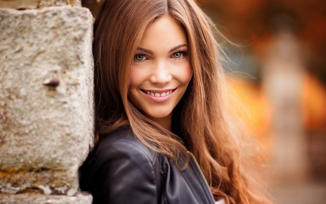 Woman longhair smiling stonewall portrait free wallpaper for desktop - medium preview image